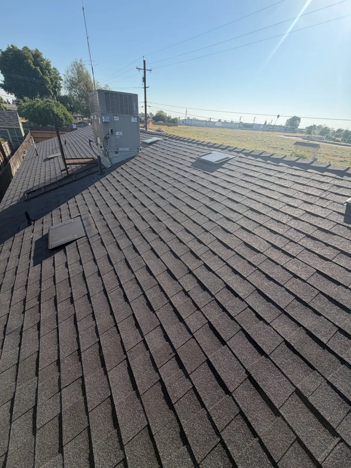 Full Roof Replacement with Re-Decking – Owens Corning Night Sky in Fowler, CA by New View Roofing – Photo 2