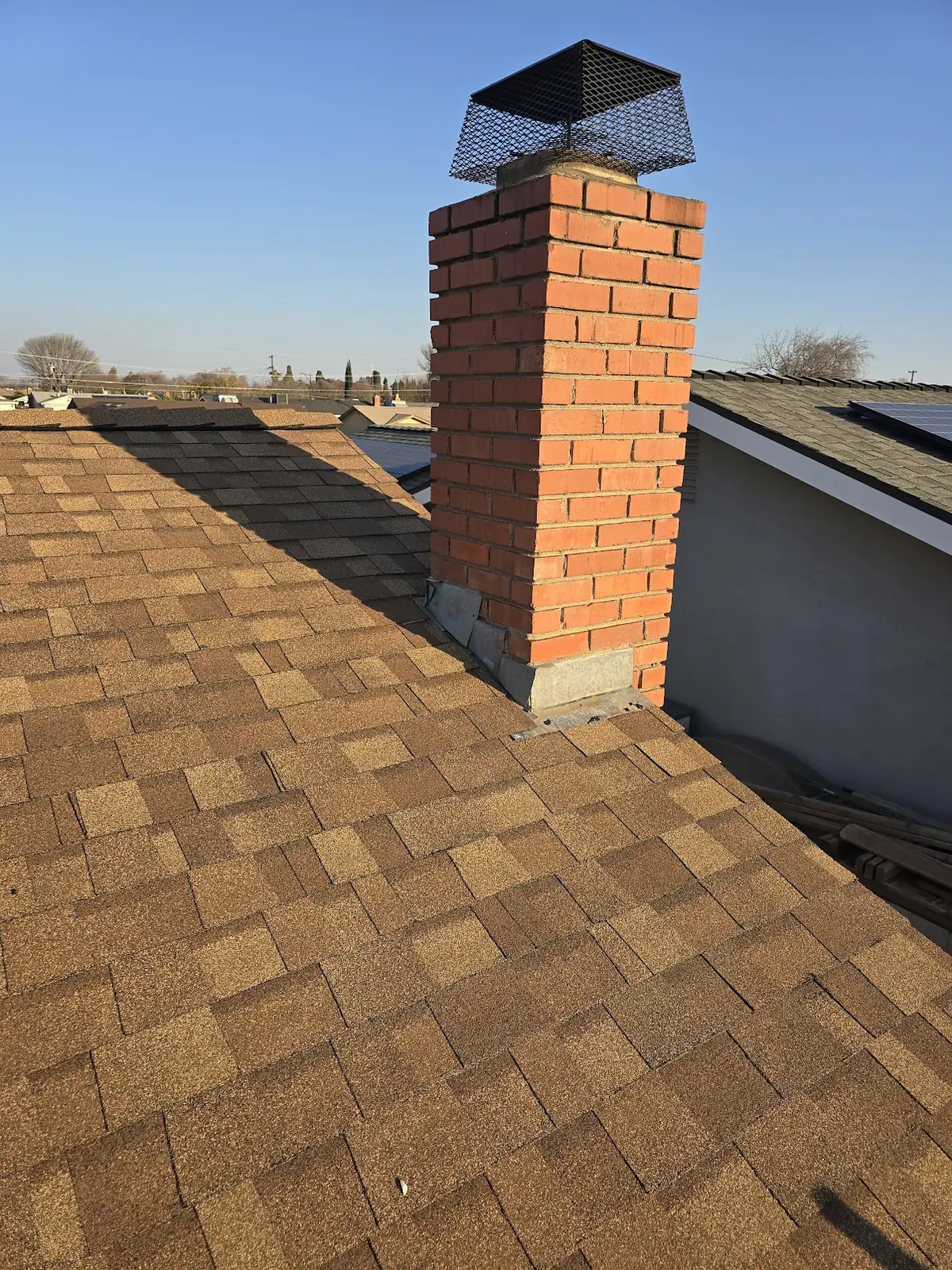 Two-Tone Reroof with Chimney Flashing & Spark Arrestor – Owens Corning Teak in Visalia, CA by New View Roofing – Photo 3